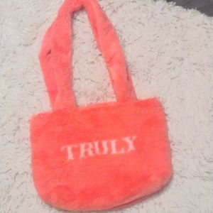 Fuzzy red/pink truly bag